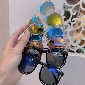 Detailed view of colorful reflective lenses on trendy children's fashion sunglasses