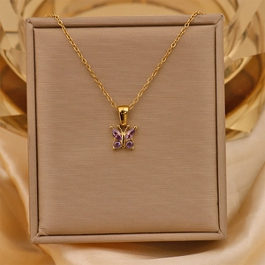 Detailed close-up of 18K gold-plated butterfly pendant with purple zircon stones