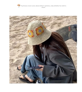 Detail of hand-crocheted bucket hat featuring sunflower patterns and woven texture