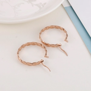 Rose gold twisted hoop earrings in stainless steel with textured rope design for women