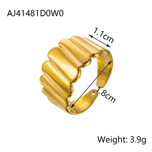 Detail view of gold-plated corrugated ring showing 1.1cm width and 1.8cm inner diameter