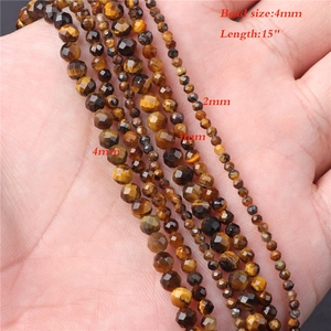 Macro detail of natural tiger eye stone beads in 2mm 3mm 4mm sizes for jewelry making