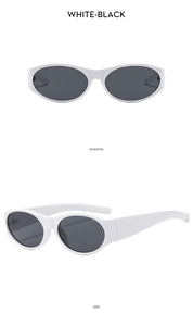 Detail view of vintage oval sunglasses with thick white frames and black lenses