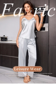 Detailed view of satin camisole set with lace trim and high-gloss silk texture