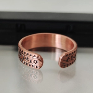 Vintage red copper magnetic ring with engraved floral patterns and adjustable C-shape band