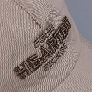 Detailed macro view of 3D letter embroidery on high-quality twill cotton baseball cap