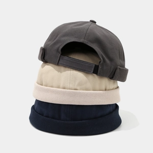 Japanese style brimless docker cap in navy, beige, and dark grey with adjustable strap