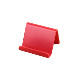 Minimalist red wedge-shaped phone and tablet stand for desk and bedside support