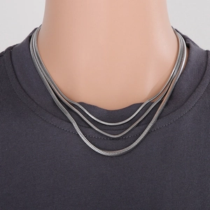 Three-layer silver snake chain necklace in stainless steel with elegant tiered design