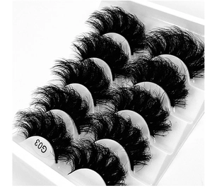 Detail of 5 pairs of thick messy G03 false eyelashes on a white display tray