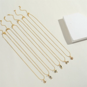 Golden 14K gold-plated ocean-themed necklaces with dolphin pendants and zircon stones