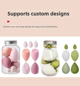 Detail showing assorted makeup sponges in tear-drop and slanted shapes with clear jars