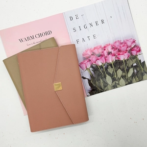 Elegant leather business notebooks in pink brown and olive green with gold metal buckle