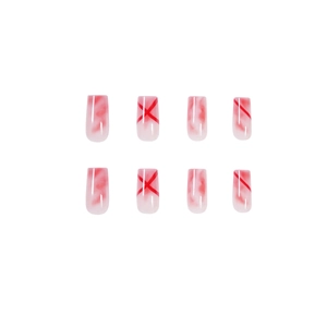 Coffin shaped press-on nails featuring red watercolor smudge and linear patterns on white