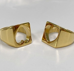 Polished gold stainless steel rings featuring minimalist hollow heart-shaped design