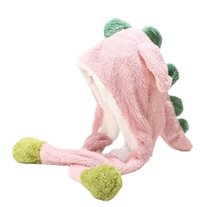Cute pink dinosaur plush hat with long earflaps and green fins for winter warmth