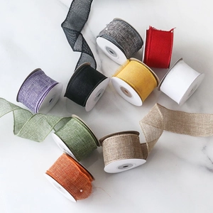 4cm colorful faux linen wired Christmas ribbons for DIY bows on white marble background