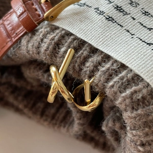 Minimalist knot-style 925 sterling silver earrings with a high-shine golden finish