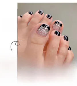 Detail of French style black toenail press-ons with white floral art and rhinestones