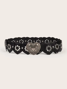 Detailed view of vintage silver heart buckle and heart-shaped leather belt stitching
