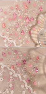 Detailed view of M-830 winter nail art stickers with pink castle and snowflake patterns