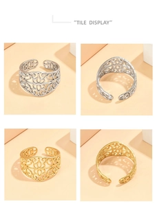 Detail display of hollow lace pattern rings in gold and silver stainless steel