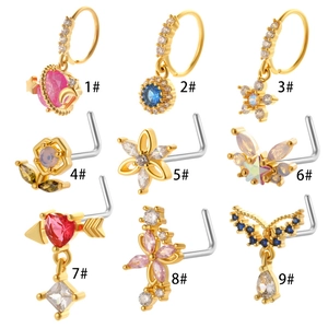 Macro view of assorted gold and silver nose studs with colorful zircon stones in 9 styles