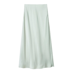 Detail shot of smooth mint green satin fabric and high waist cut of the midi skirt