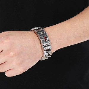 Men's punk stainless steel chain bracelet with red-eyed skull centerpiece in silver