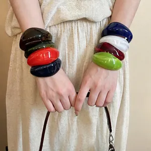 Irregular chunky acrylic open bangles in vibrant colors for vintage fashion style