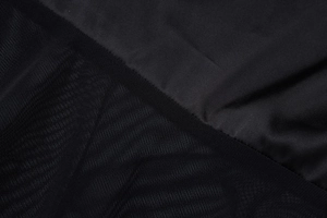 Detailed macro view showing the contrast between smooth fabric and delicate mesh lace textures