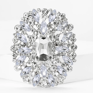 Detailed macro view of large glass rhinestone brooch with radiant Art Deco silver design