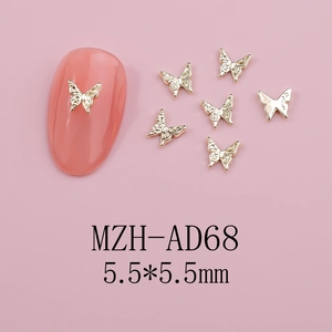 Detailed view of 5.5mm gold butterfly metal charms for 3D nail art decoration