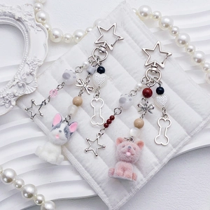 Cute flocked puppy pendants with star clasps and pearls on white quilted fabric