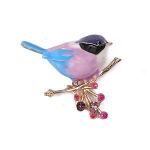 Minimalist enamel bird brooch with gradient blue and pink colors and purple crystal