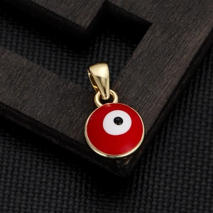 Macro shot of a red and gold enamel evil eye pendant charm for DIY jewelry making
