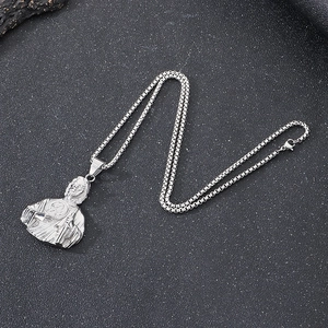 Vintage silver stainless steel box chain necklace with St. Jude bust pendant on dark surface