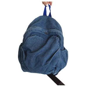 Vintage blue denim backpack for women featuring a pleated design and front zipper pocket