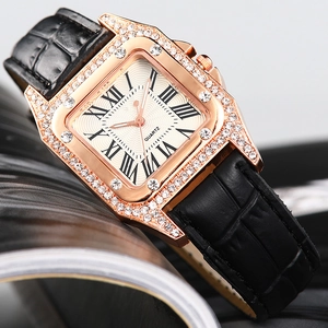 Detailed macro view of the square rose gold watch case with crystal diamond bezel