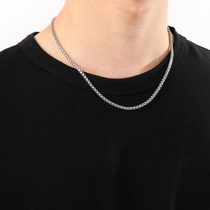 Close-up of 3.5mm silver stainless steel box chain necklace worn by a male model