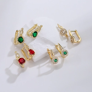 18K gold plated U-shaped earrings set with colorful zircon stones on a white stone