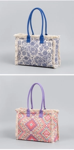 Detail of bohemian canvas tote bags featuring paisley patterns and fringe tassel accents