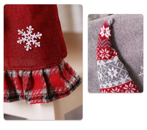 Detail of Christmas chair cover showing linen fabric, snowflake patch and knit texture