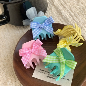 Floral acetate hair claw set with plaid bows in mint green, pink, blue, and yellow