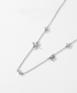 Detailed close-up of S925 silver necklace featuring various zircon stone cuts