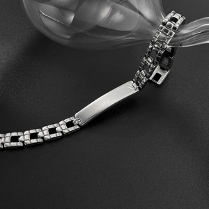 Polished stainless steel men's ID curb chain bracelet with a blank rectangular metal bar