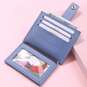 Detailed interior of blue leather card wallet showing slots and clear ID window