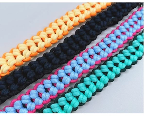 Close-up of four colorful hand-woven nylon paracord shoulder straps for handbag accessories