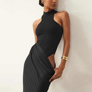 Detail of a black sleeveless hollow-out dress featuring a stylish waist cutout design