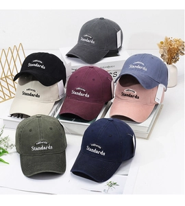 Collection of embroidered washed cotton baseball caps in various vintage colors